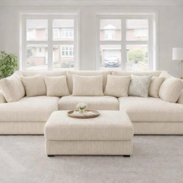 Cream jumbo cord U shape sofa with matching footstool and deep cushioned seating for modern living rooms