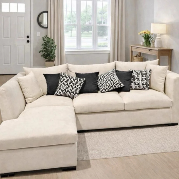 Cream L-shaped corner sofa with patterned scatter cushions in a modern living room