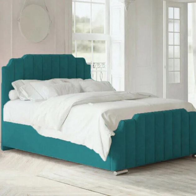 Florida upholstered bed frame in teal fabric with vertical channel tufting and matching footboard.
