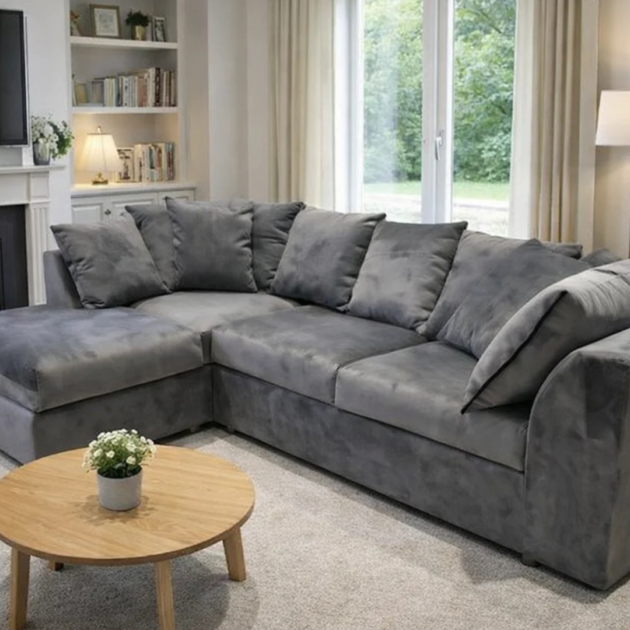 Grey chenille corner sofa with plush cushions and spacious lounge seating in a modern home
