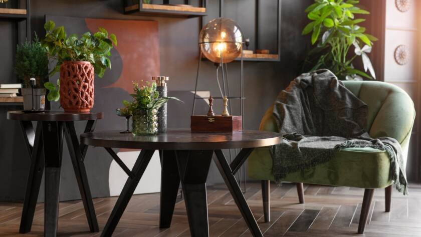 Luxury living room décor featuring designer tables, accent chair, decorative accessories and statement lighting