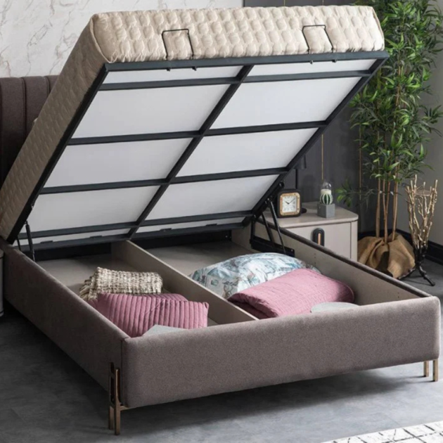 Luxury upholstered ottoman storage bed frame with lift-up mattress base and spacious under-bed storage in modern bedroom